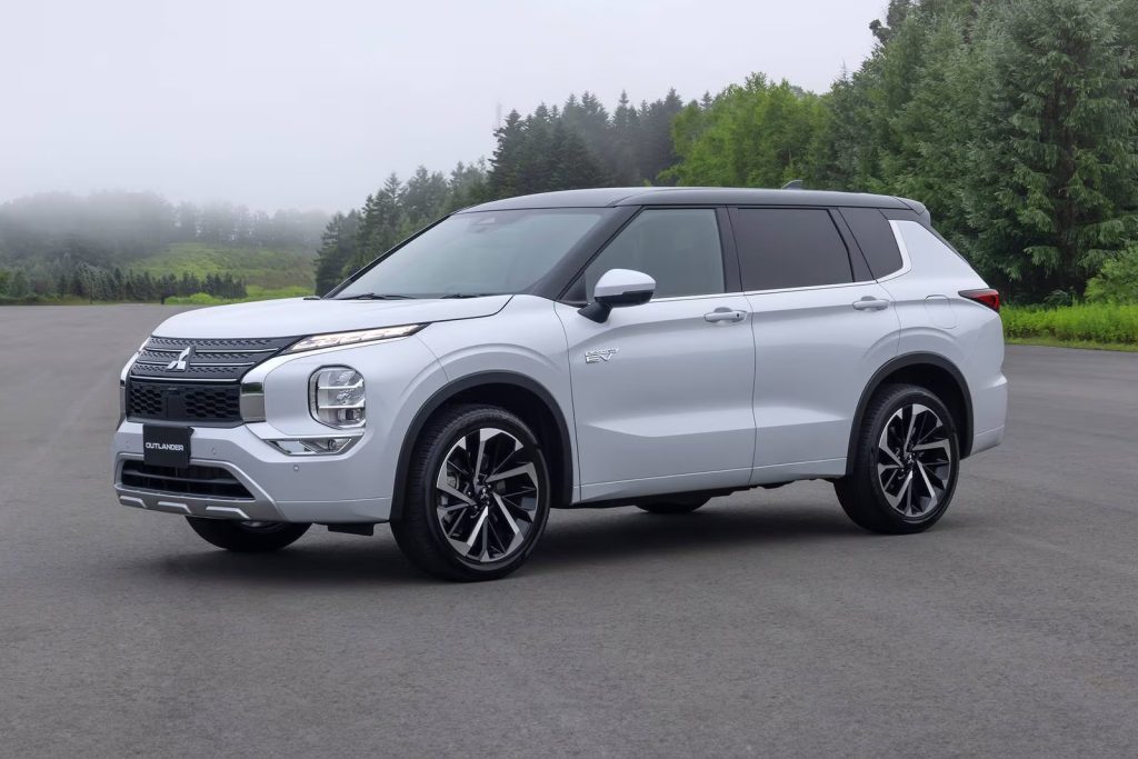 White Mitsubishi Outlander PHEV SUV parked
